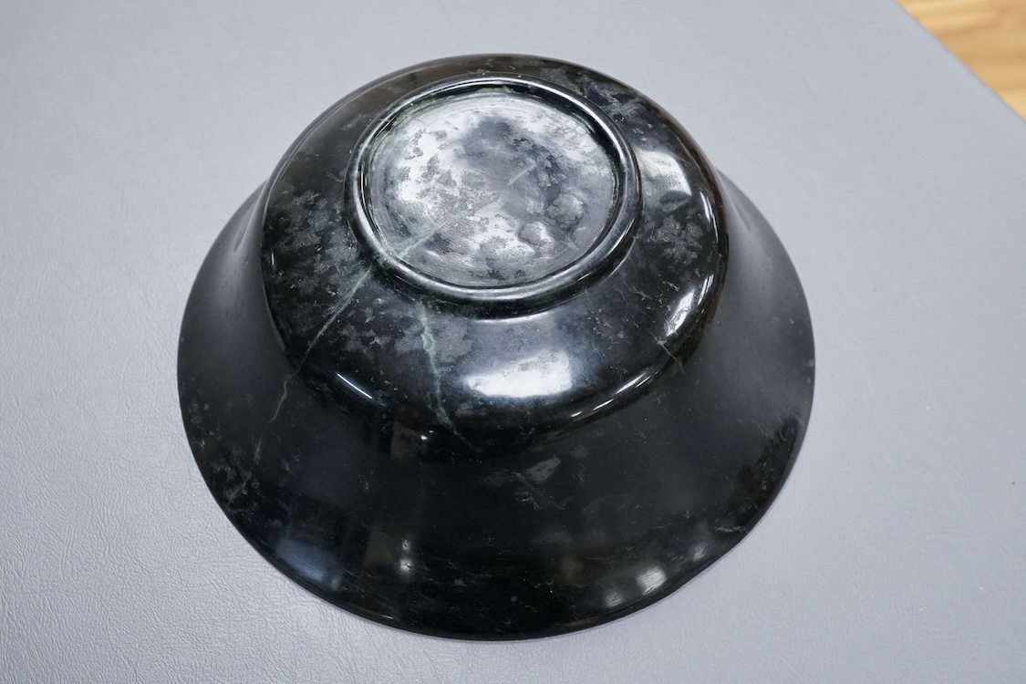 A Chinese spinach green jade bowl, 21cm diameter